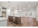 Modern kitchen with a large island, stainless steel appliances, and an open layout at 686 Smokey Quartz Way, Kennesaw, GA 30144