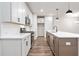 Modern kitchen featuring an island, stainless steel appliances, and white countertops at 686 Smokey Quartz Way, Kennesaw, GA 30144