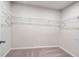 Spacious walk-in closet includes wire shelving for ample storage, and neutral carpet at 686 Smokey Quartz Way, Kennesaw, GA 30144