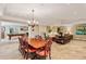Open-concept basement with pool table, fireplace, dining area, and comfortable seating at 1762 Nancy Creek Bluff, Atlanta, GA 30305