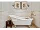 Elegant bathroom featuring a classic clawfoot tub and stylish wall sconces at 1762 Nancy Creek Bluff, Atlanta, GA 30305
