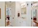 Bright bathroom featuring white cabinets, modern fixtures, and views into two bedrooms at 1762 Nancy Creek Bluff, Atlanta, GA 30305