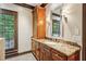 Bathroom featuring a marble countertop, vanity, and custom wood cabinetry at 1762 Nancy Creek Bluff, Atlanta, GA 30305