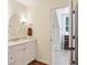 Well-lit bathroom featuring a marble countertop and access to a shower at 1762 Nancy Creek Bluff, Atlanta, GA 30305