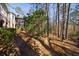 Beautiful home exterior with a screened porch and wooded surroundings, providing a private retreat at 1762 Nancy Creek Bluff, Atlanta, GA 30305