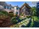 Stunning home exterior with screened porch, manicured landscaping, and beautiful brick accents at 1762 Nancy Creek Bluff, Atlanta, GA 30305