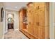 Hallway features custom storage cabinets and drawers plus a glimpse into the powder room at 1762 Nancy Creek Bluff, Atlanta, GA 30305