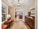 Elegant hallway with tile floors, custom cabinetry, and natural lighting from the windows at 1762 Nancy Creek Bluff, Atlanta, GA 30305