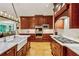 Spacious kitchen features a farmhouse sink, marble countertops, and stainless steel appliances at 1762 Nancy Creek Bluff, Atlanta, GA 30305