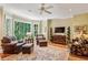 Cozy sunroom with comfortable seating, large bay window, and views of the surrounding greenery at 1762 Nancy Creek Bluff, Atlanta, GA 30305
