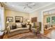 Relaxing sitting room featuring an area rug, couch, and plenty of natural light at 1762 Nancy Creek Bluff, Atlanta, GA 30305