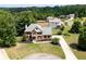 Aerial view of a two-story home with brick facade and landscaping at 416 Telfair Way, Canton, GA 30115