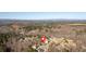 A residential area with mature trees and winding roads as seen from above at 416 Telfair Way, Canton, GA 30115