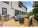 View of the back deck with grill, patio table set, and a view at 416 Telfair Way, Canton, GA 30115