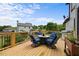 Outdoor living space with back deck, gas grill, and seating area with view at 416 Telfair Way, Canton, GA 30115