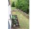 A well-maintained backyard with green grass, a wooden fence, and flower beds at 416 Telfair Way, Canton, GA 30115