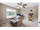 Comfortable bedroom with a ceiling fan and a seating area at 416 Telfair Way, Canton, GA 30115
