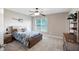 Comfortable bedroom features a ceiling fan and lots of natural light from the large window at 416 Telfair Way, Canton, GA 30115