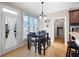 Cozy breakfast nook with a small table, bench seating, and a door to the outside at 416 Telfair Way, Canton, GA 30115
