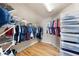 Walk-in closet with custom shelving and ample storage space for clothing and accessories at 416 Telfair Way, Canton, GA 30115