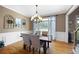 Stylish dining room with decor, a chandelier, and a window with curtains at 416 Telfair Way, Canton, GA 30115