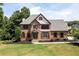 Charming two-story brick home with manicured lawn and neatly trimmed landscaping at 416 Telfair Way, Canton, GA 30115