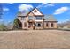 Traditional two-story brick home with a manicured lawn and inviting front entrance at 416 Telfair Way, Canton, GA 30115