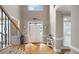 Light-filled foyer with high ceilings, hardwood floors, and an elegant entryway at 416 Telfair Way, Canton, GA 30115