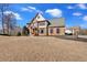 Expansive front yard with a two-story brick home with an attached garage at 416 Telfair Way, Canton, GA 30115