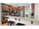 Well-equipped kitchen with granite countertops, stainless steel appliances, and a breakfast bar at 416 Telfair Way, Canton, GA 30115