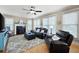 Bright living room with hardwood floors, a fireplace, and plenty of natural light at 416 Telfair Way, Canton, GA 30115