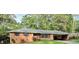 Quaint one-story brick home featuring mature trees and a convenient carport, offering comfort and style at 5535 Beaver Sw Dr, Mableton, GA 30126