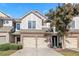 Charming townhouse featuring a brick facade and two-car garage, set against a blue sky at 1533 Park Brooke Sw Cir # 6, Marietta, GA 30008