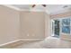 Neutral bedroom featuring ceiling fan and access to private balcony at 1850 Cotillion Dr # 3305, Atlanta, GA 30338