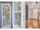 Inviting living room featuring hardwood floors and access to an outdoor balcony or patio at 1850 Cotillion Dr # 3305, Atlanta, GA 30338