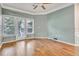 Spacious living room with hardwood floors, large windows, and elegant crown molding at 1850 Cotillion Dr # 3305, Atlanta, GA 30338