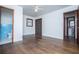 Bedroom features hardwood floors and leads to two bathrooms with colorful tile at 2283 Country Club Sw Ln, Atlanta, GA 30311