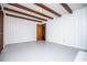 Living room with gray carpet, white wainscoting, and exposed wood beams at 2283 Country Club Sw Ln, Atlanta, GA 30311