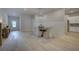 Open dining room with modern chandelier and hardwood floors at 96 Whites Pond Rd, Moreland, GA 30259