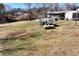 Extensive backyard with fenced in pool and other yard features and construction in progress in the distance at 1370 Cronic Town Rd, Auburn, GA 30011