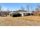 Home with backyard and auxiliary storage building at 1370 Cronic Town Rd, Auburn, GA 30011