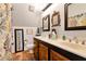 Well-lit bathroom with double sinks, framed mirrors, and a decorative shower curtain for a stylish touch at 1370 Cronic Town Rd, Auburn, GA 30011