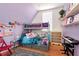 Colorful bedroom showcasing a bunk bed, playful decor, and ample storage space at 1370 Cronic Town Rd, Auburn, GA 30011