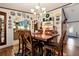 Bright dining room featuring a large table with seating for six and stylish décor at 1370 Cronic Town Rd, Auburn, GA 30011