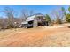 Unique property featuring garage parking and an elevated patio in a rural setting at 1370 Cronic Town Rd, Auburn, GA 30011