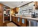 Kitchen with wooden cabinets, stainless steel appliances and a pantry for extra storage at 1370 Cronic Town Rd, Auburn, GA 30011