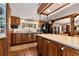 Kitchen with wooden cabinets, stainless steel appliances and an island with a breakfast bar at 1370 Cronic Town Rd, Auburn, GA 30011