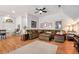 Comfortable living room featuring hardwood floors, a ceiling fan, and stylish decor at 1370 Cronic Town Rd, Auburn, GA 30011