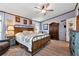 Charming main bedroom with a ceiling fan, wooden floors, and stylish furniture at 1370 Cronic Town Rd, Auburn, GA 30011