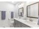 Bright bathroom featuring double sinks, gray cabinets, and modern fixtures at 2700 Pine Tree Ne Rd # 2201, Atlanta, GA 30324